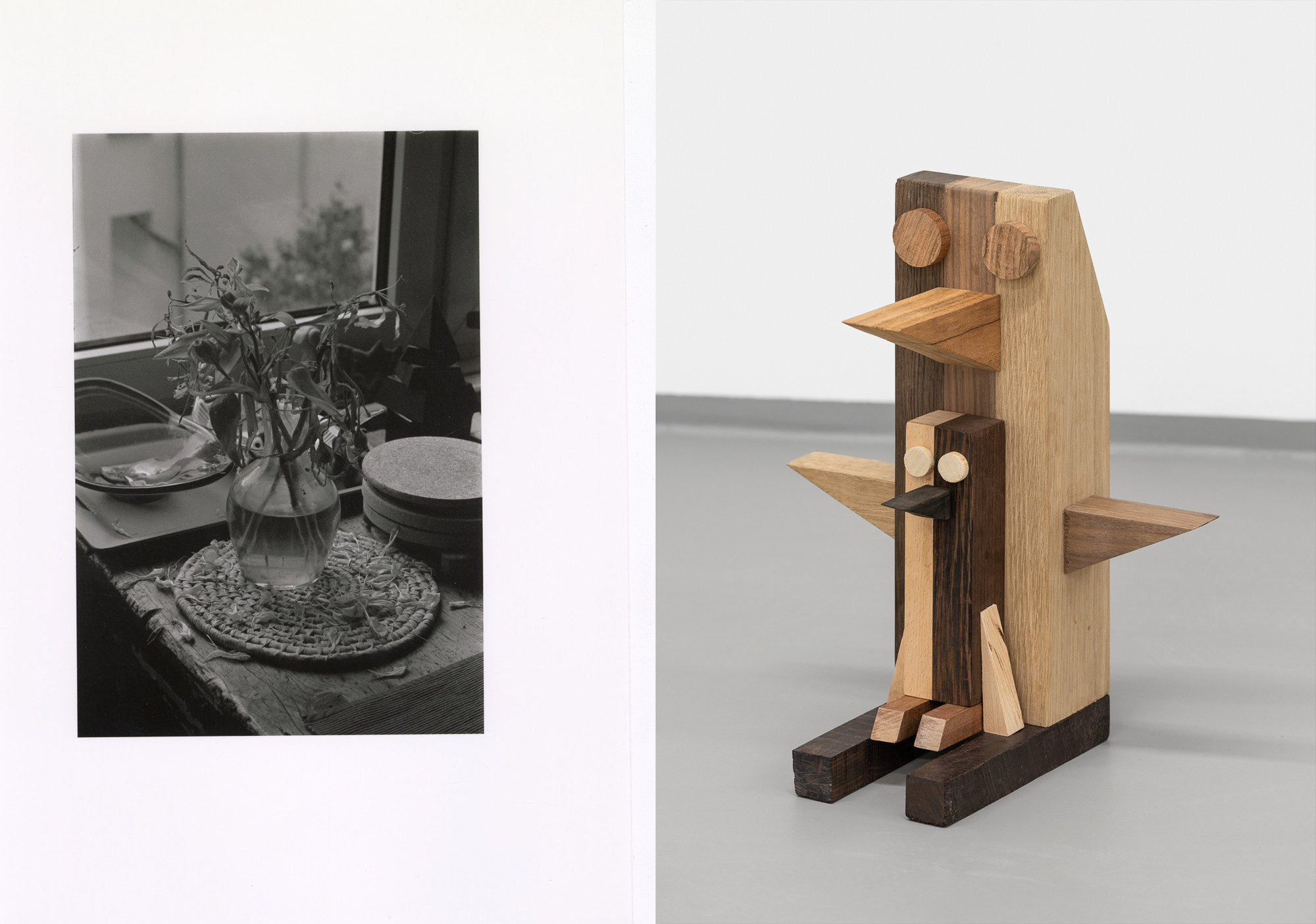 Two images. Left side is a black and white close up photo of a table with different obejcts, such as a vase with flowers and a bowl. Right side is wooden sculpture that resembles a large and a small penguine