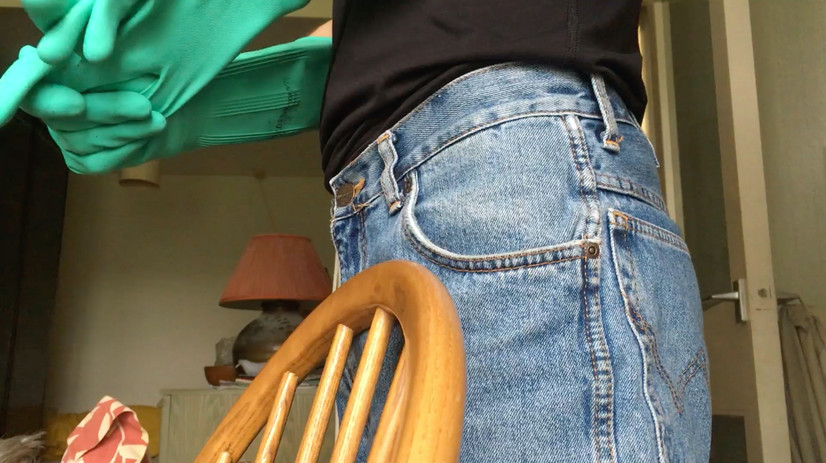 Still from video depicting the artist cleaning his father's apartment